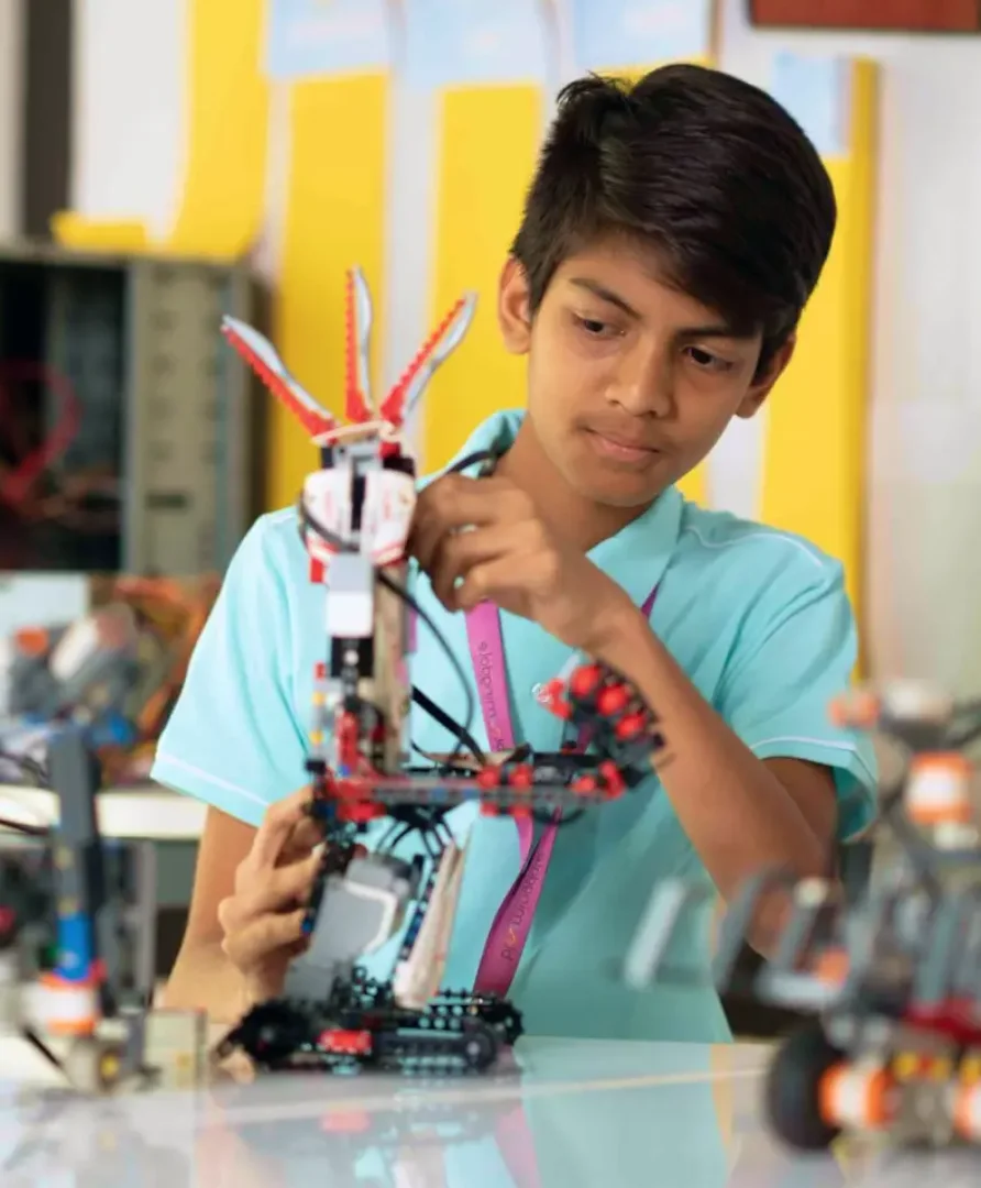girl jumping over a hurdle